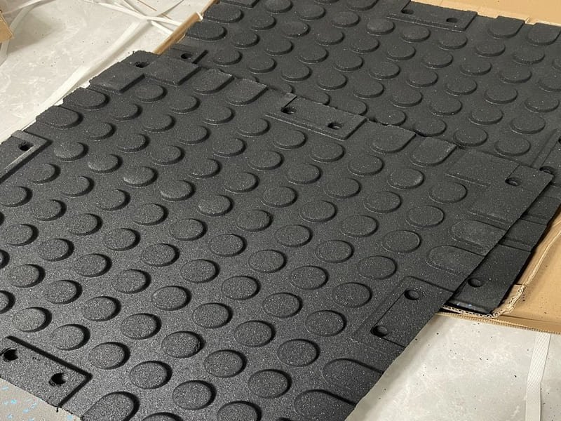 An installer using a moisture meter on a concrete subfloor